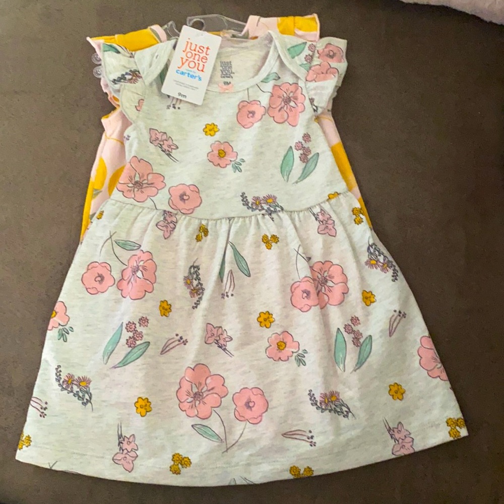 Carter’s floral dress and lemon jumper